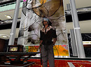 Chrome standing in front of digital mural, Orbit