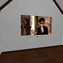 watching Yoko Ono's videos in Second Life - Koinup Burt